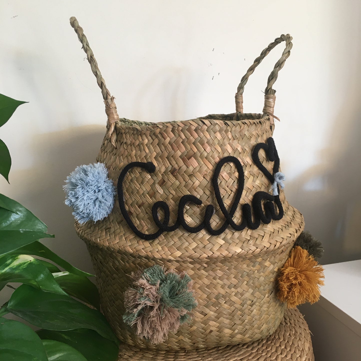 Wicker basket with name and pom pom