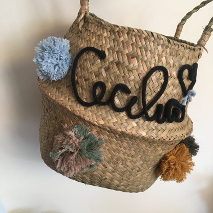 Wicker basket with name and pom pom