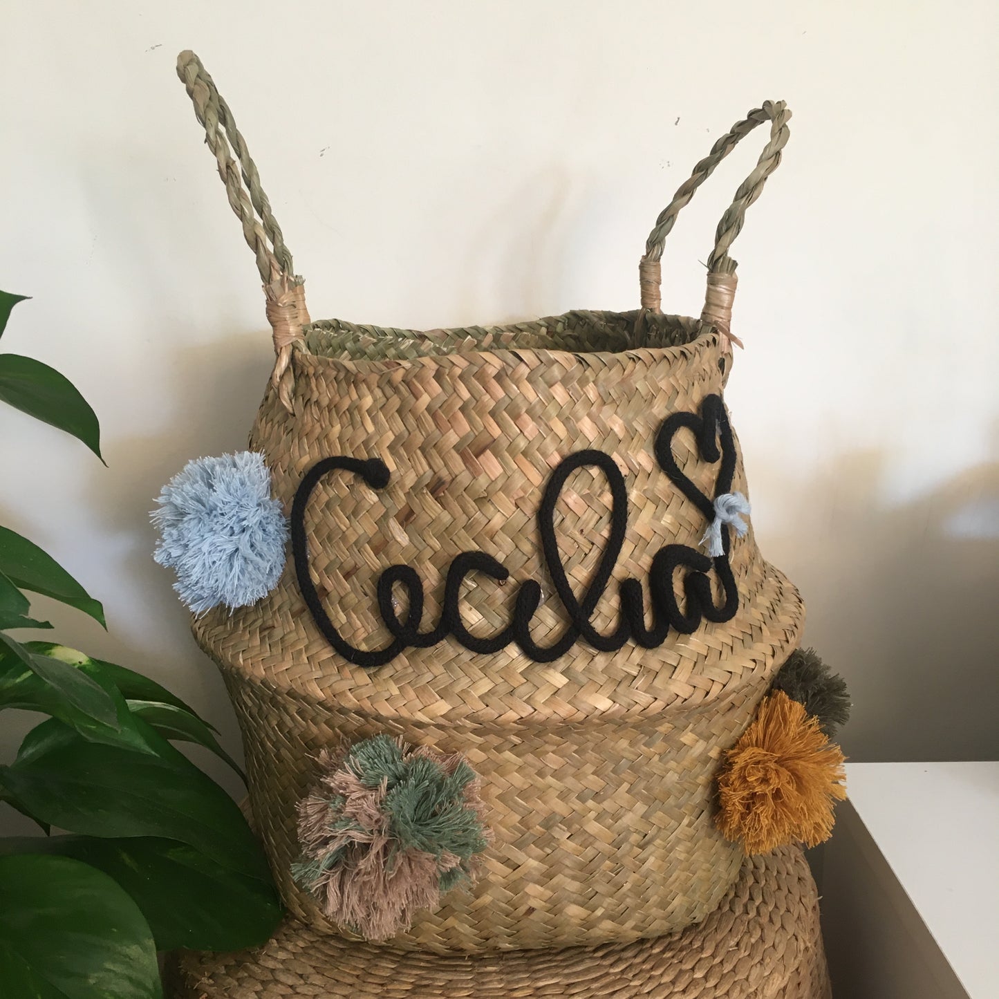 Wicker basket with name and pom pom